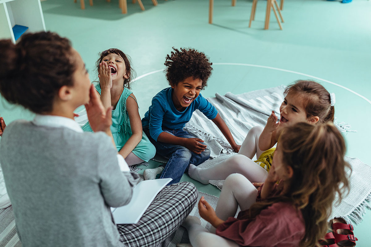 children sitting together laughing